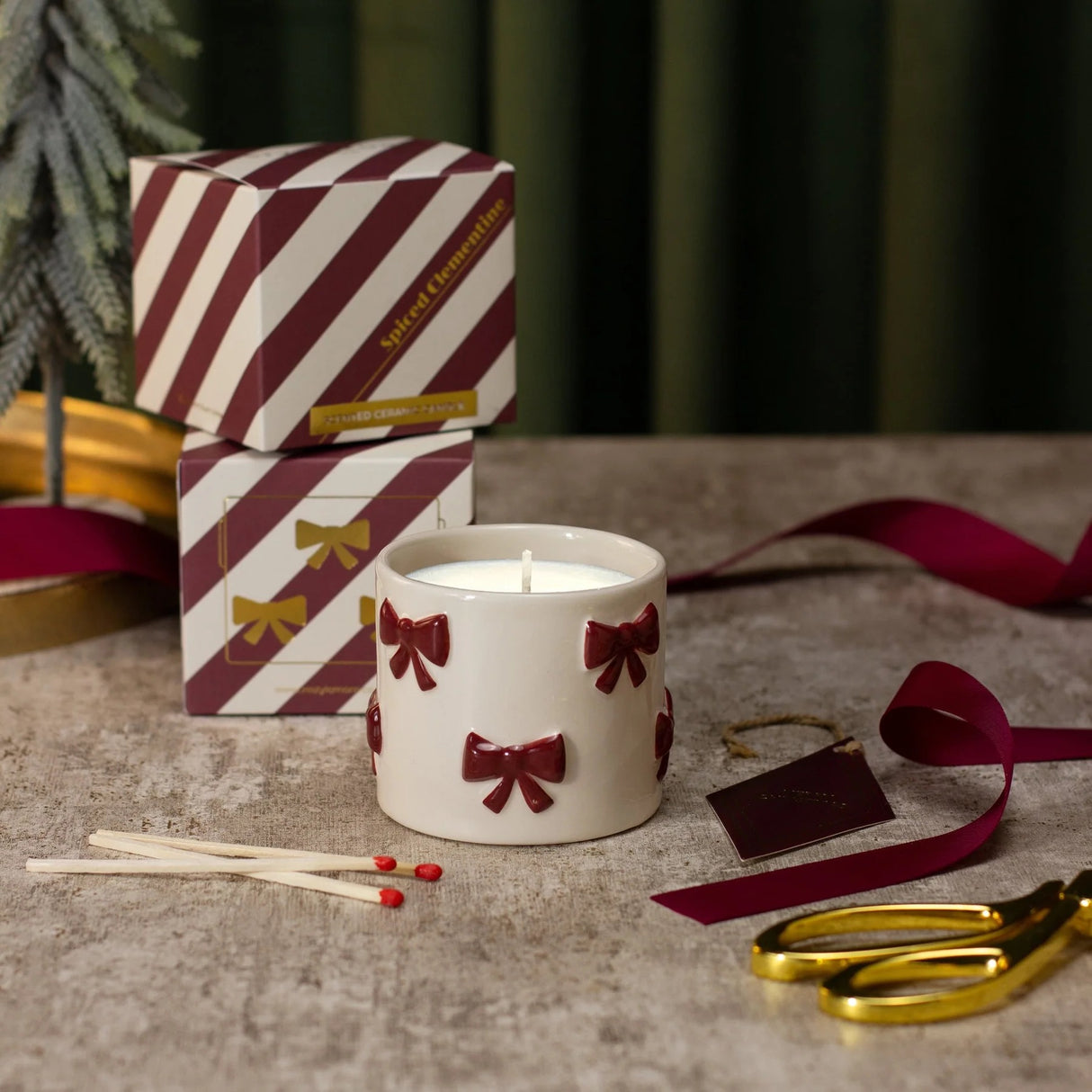 UNDER THE TREE: BURGUNDY BOW CANDLE - SPICED CLEMENTINE