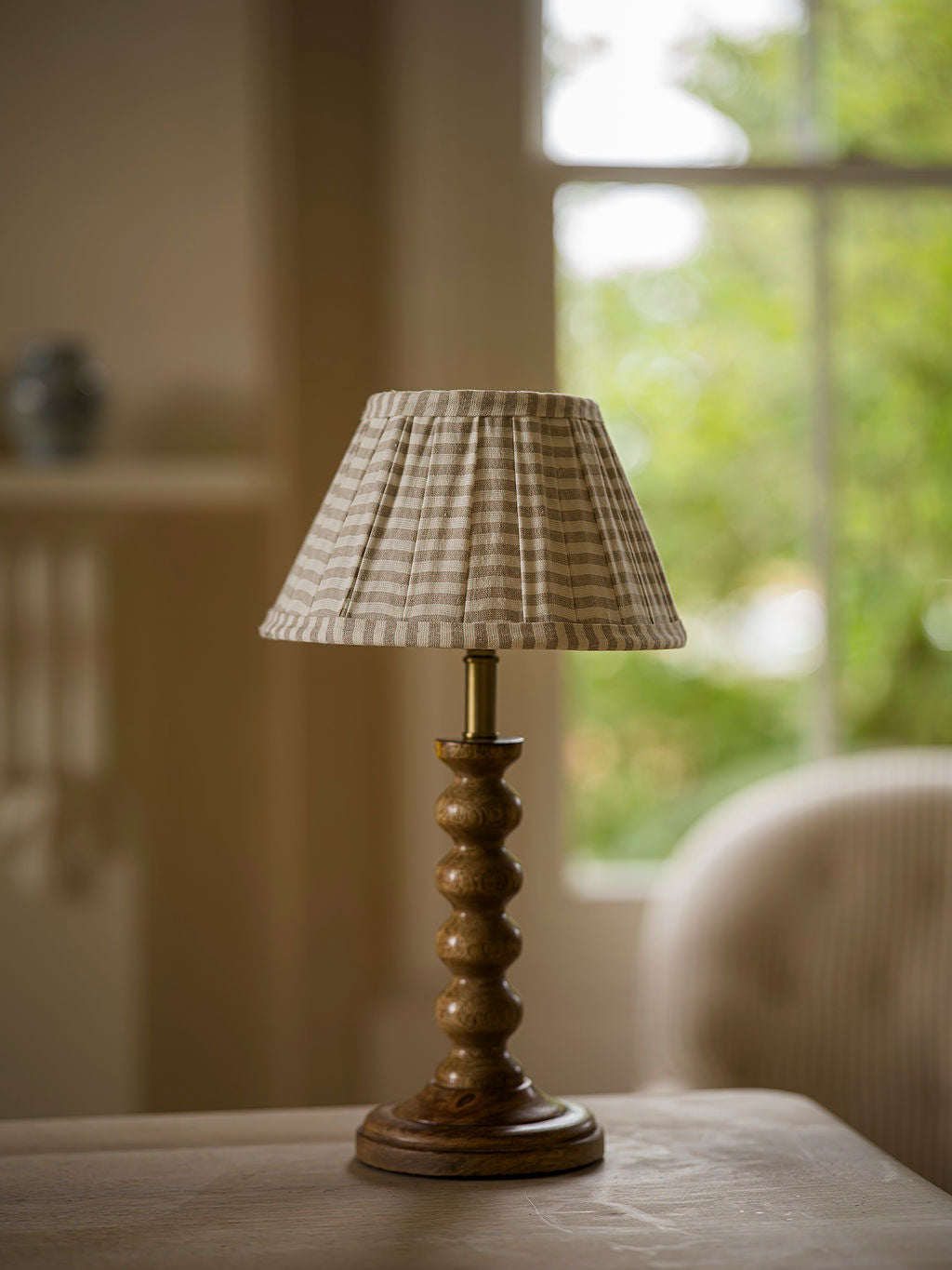 The Bobbin Table Lamp Natural with striped pleated shade
