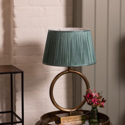 brass round lamp base with green pleated shade